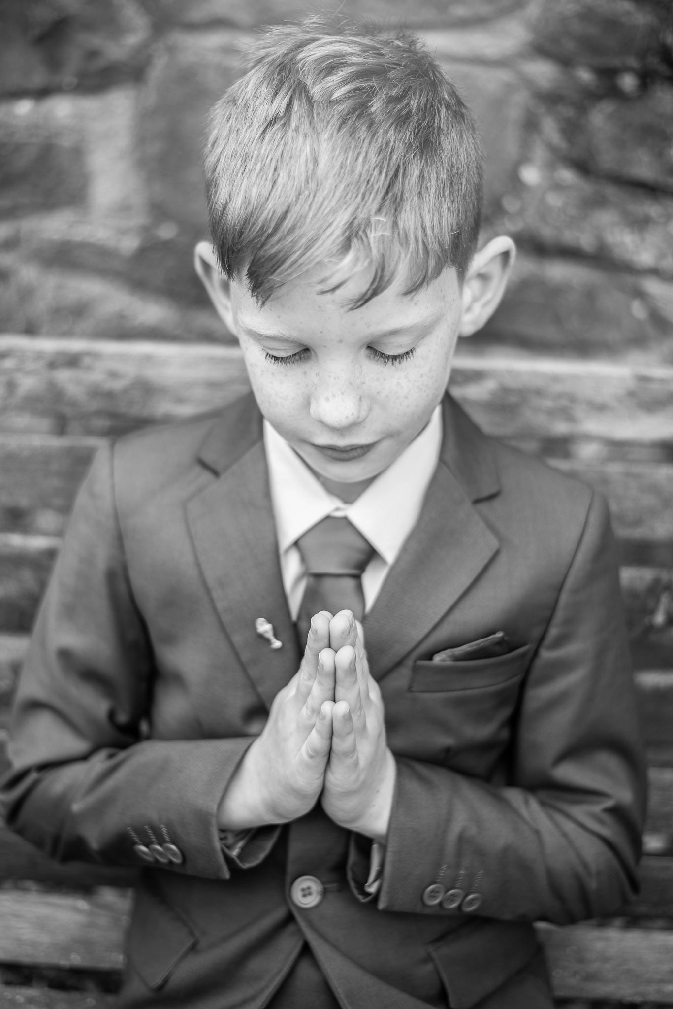 Child in communion outfit during a outdoor session at their home in Killarney.